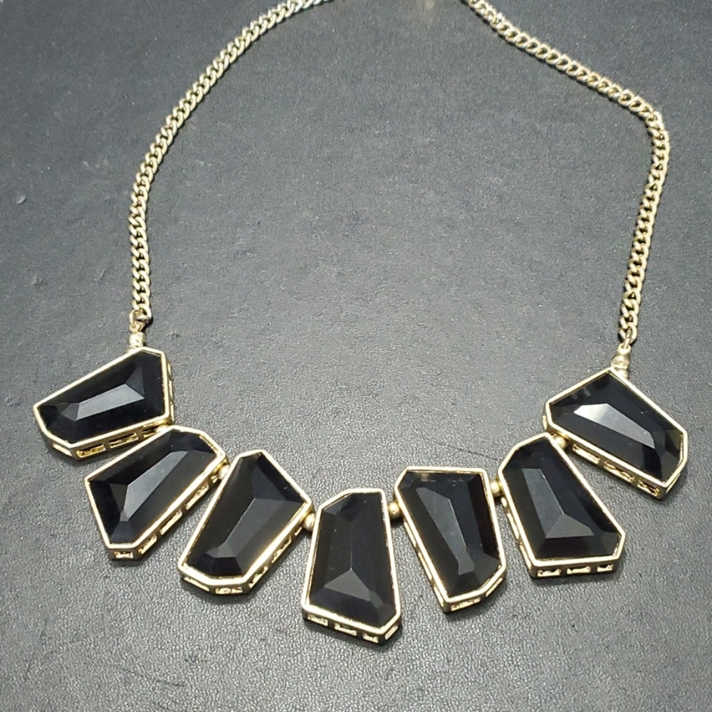 Gold tone and black necklace